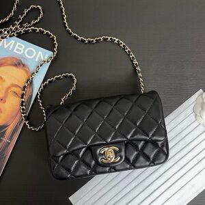 CHANEL Black Quilted Lambskin Mini Flap Bag with Gold Chain